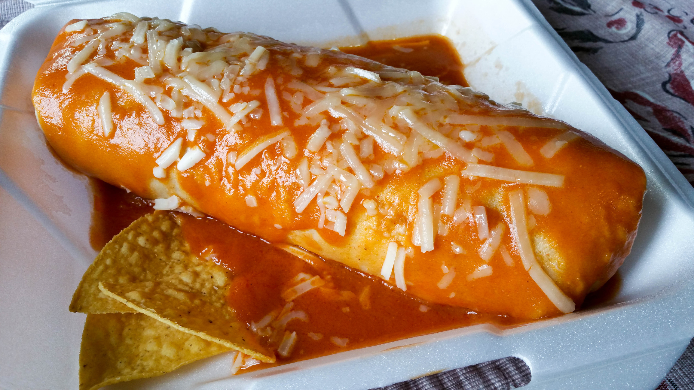 Wet chicken burrito with red sauce