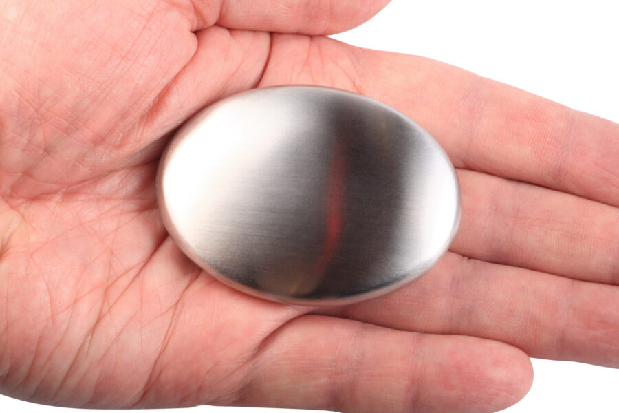 hand holding stainless steel soap bar