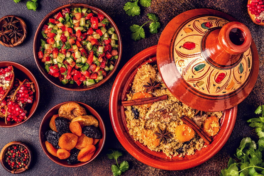 Traditional moroccan tajine of chicken with dried fruits and spices, top view.