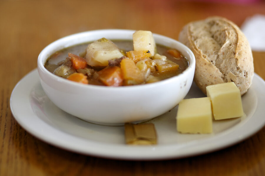 Traditional Welsh broth on a plate with bread