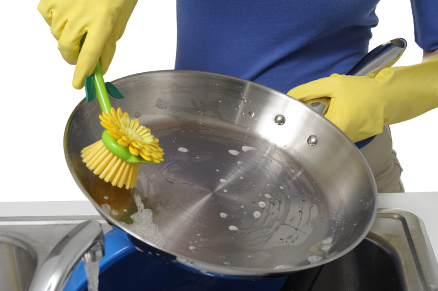 Young Woman Washing Dishes