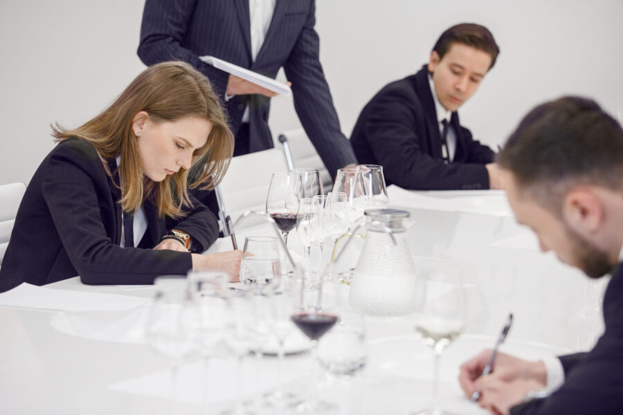 Female sommelier passes training for get the certification. Wine waiter school, winemaking lecture.