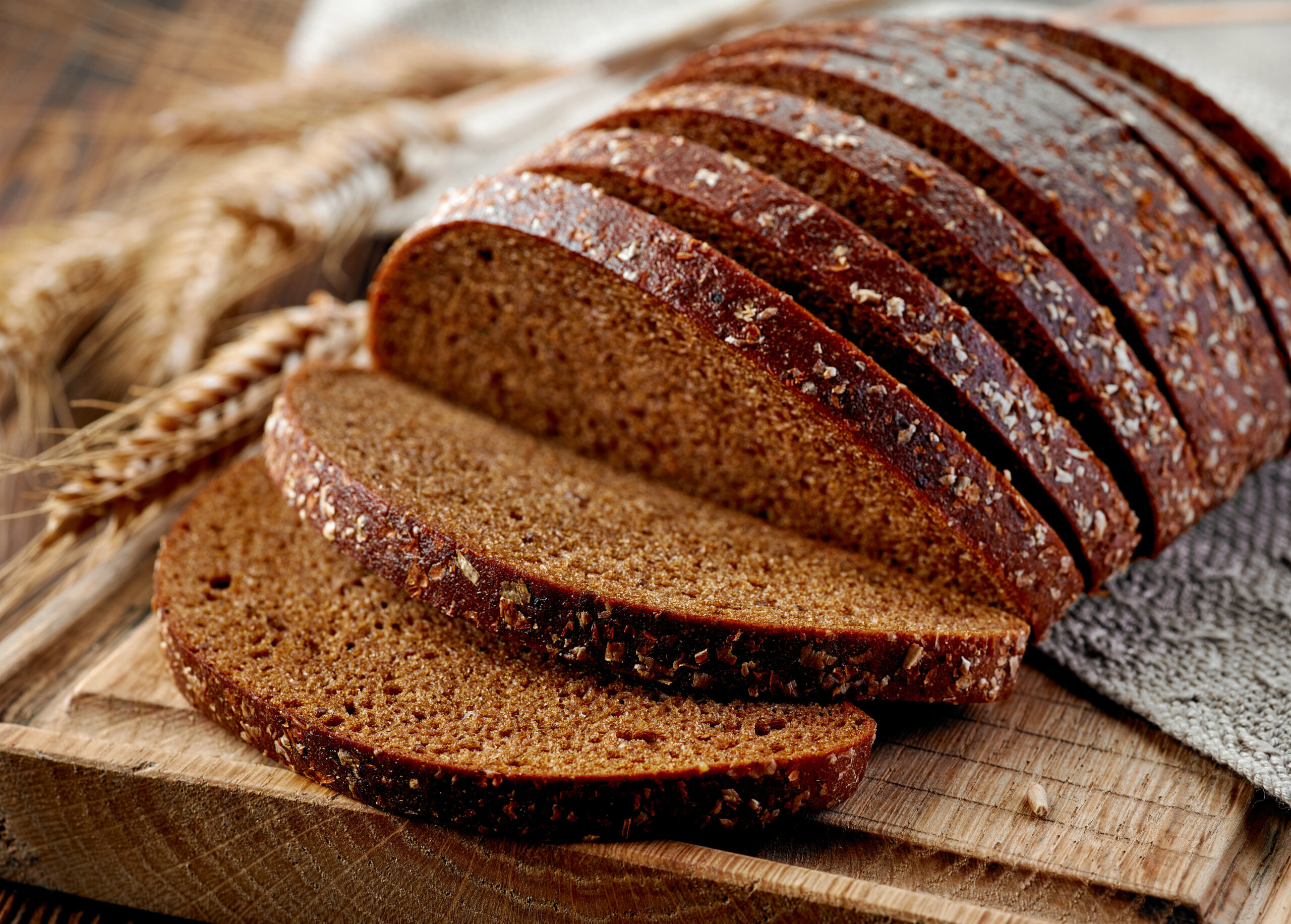 fresh rye bread on wooden cutting board