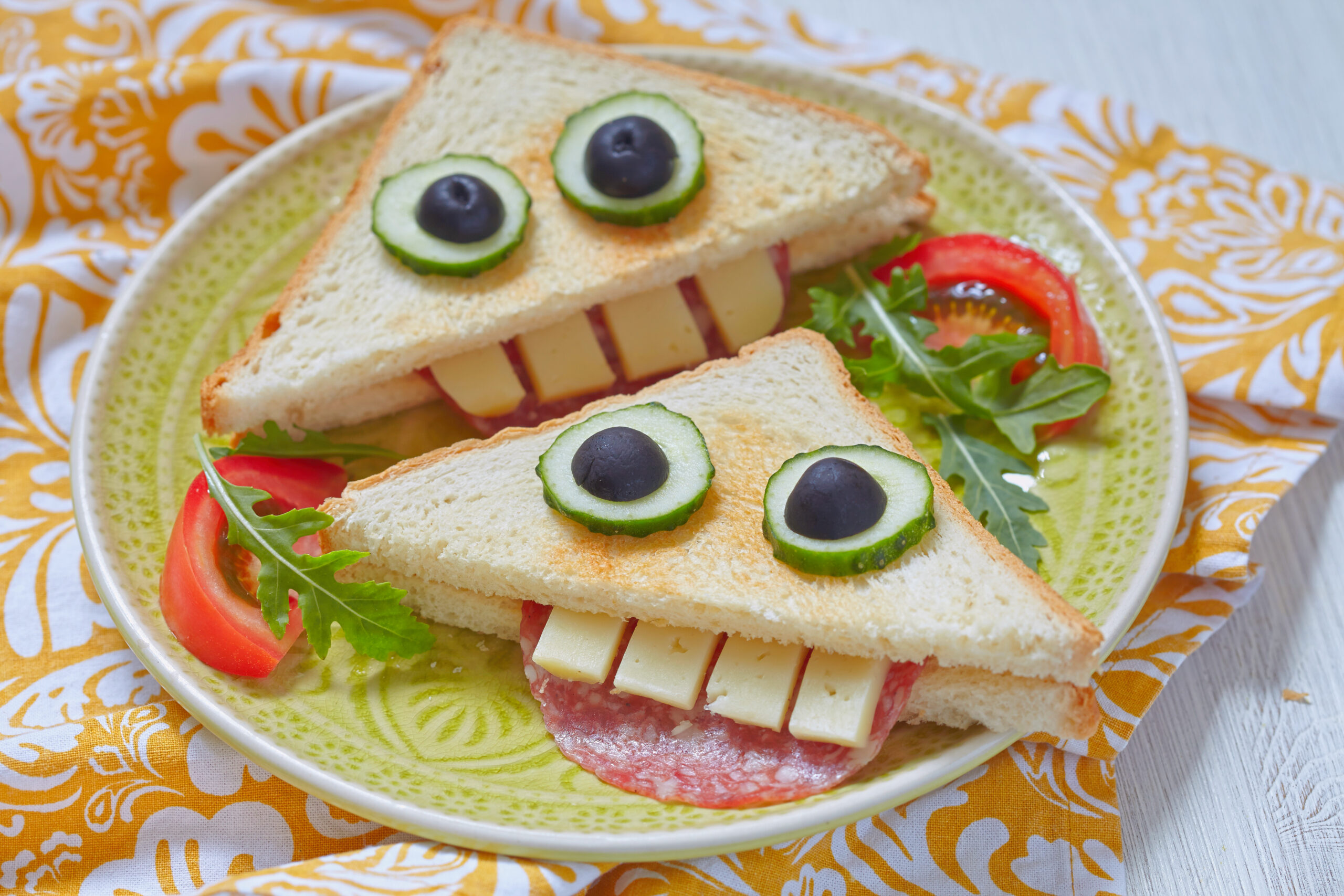 Funny sandwich for kids lunch on a table