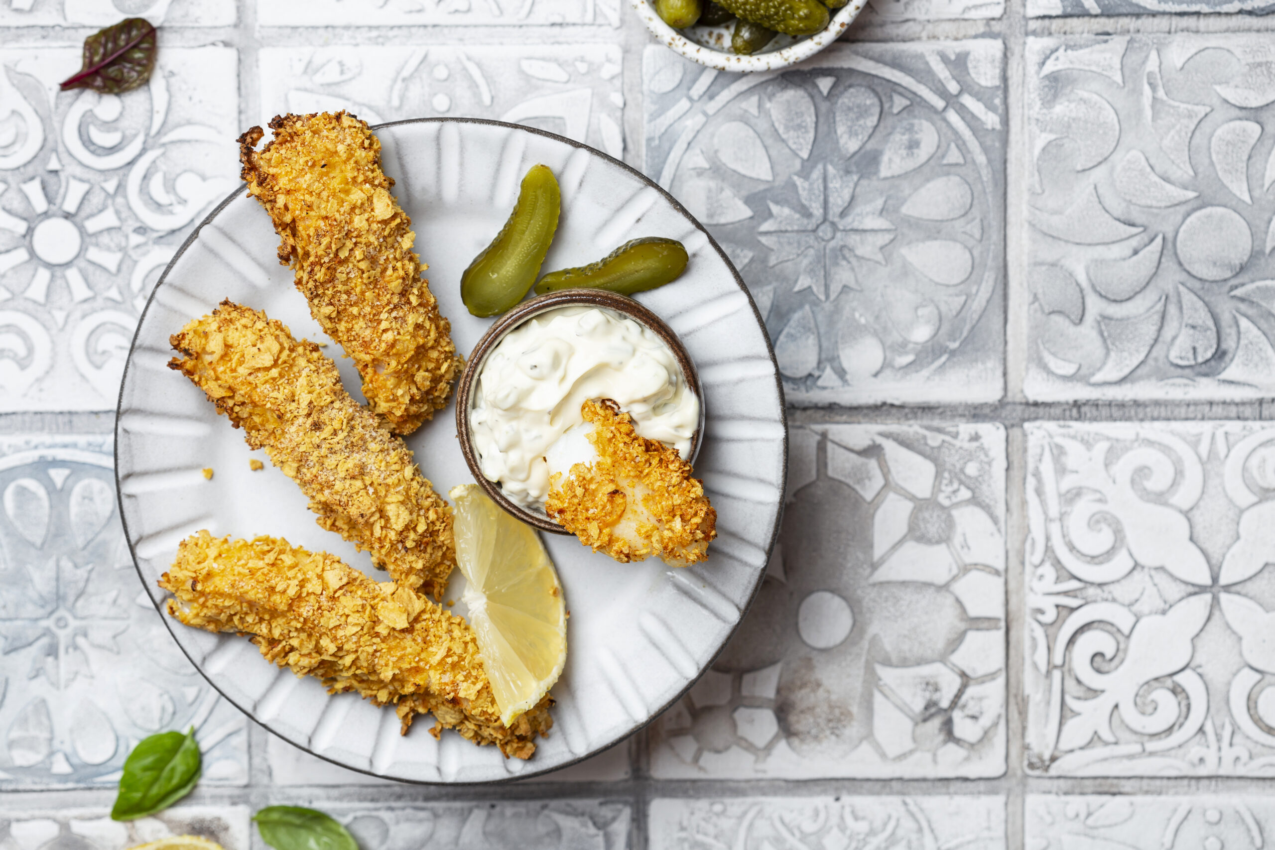 Homemade fresh fish finger with tartar sauce and lemon