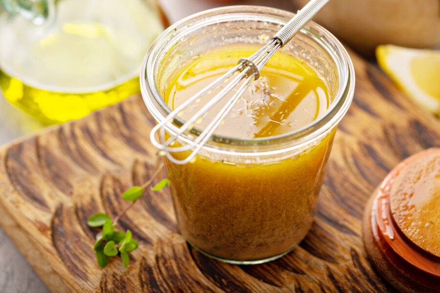 greek salad dressing or marinade in a glass jar