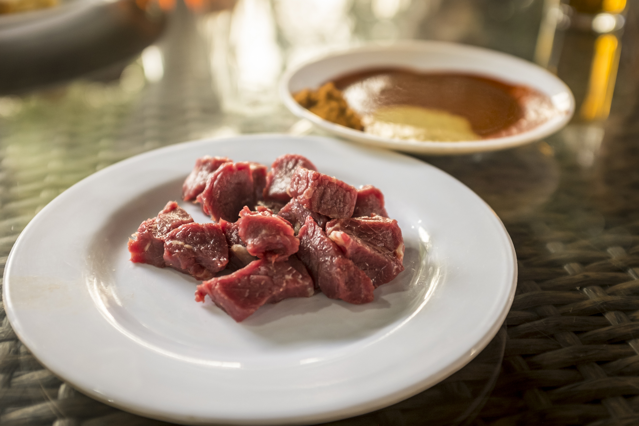 Cubes of tere siga (raw meat) served with various sauces and spices called Awaze, Mitmita and Senafich in Ethiopia