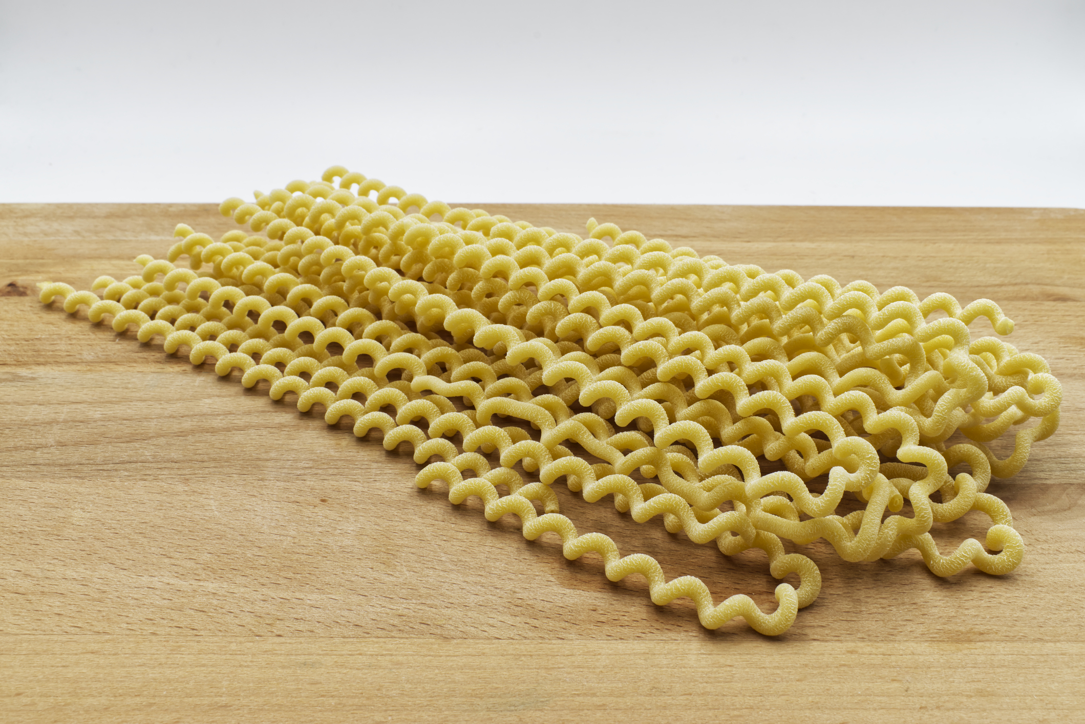 Traditional italian pasta on wooden table.