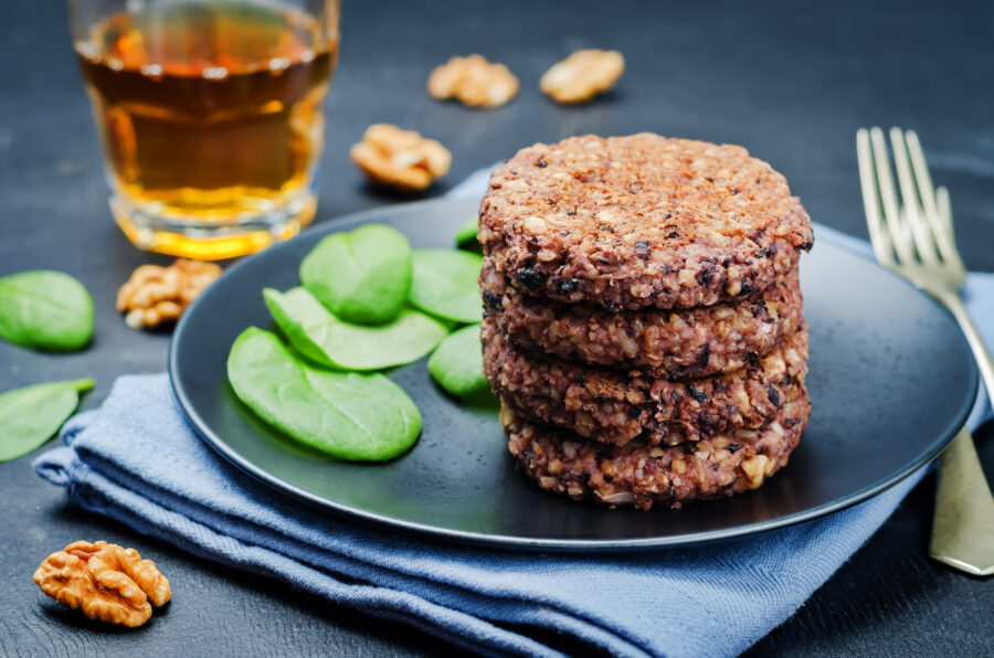 black beans brown rice walnut oat burgers with spinach. toning. selective focus