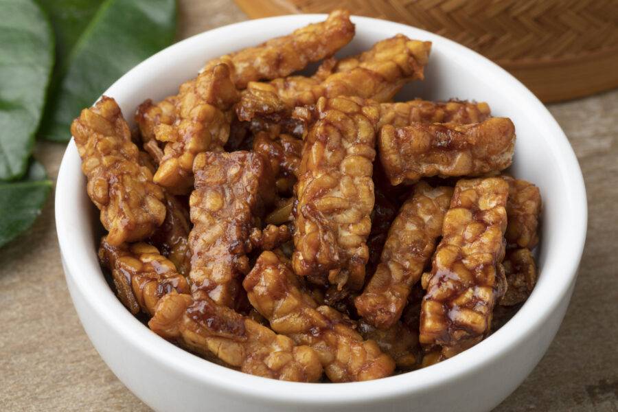 Bowl with fresh homemade Indonesian sambal tempeh goreng close up