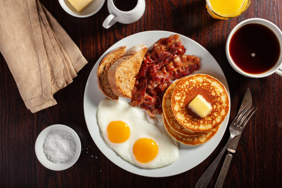 eggs, pancakes with bacon and toast