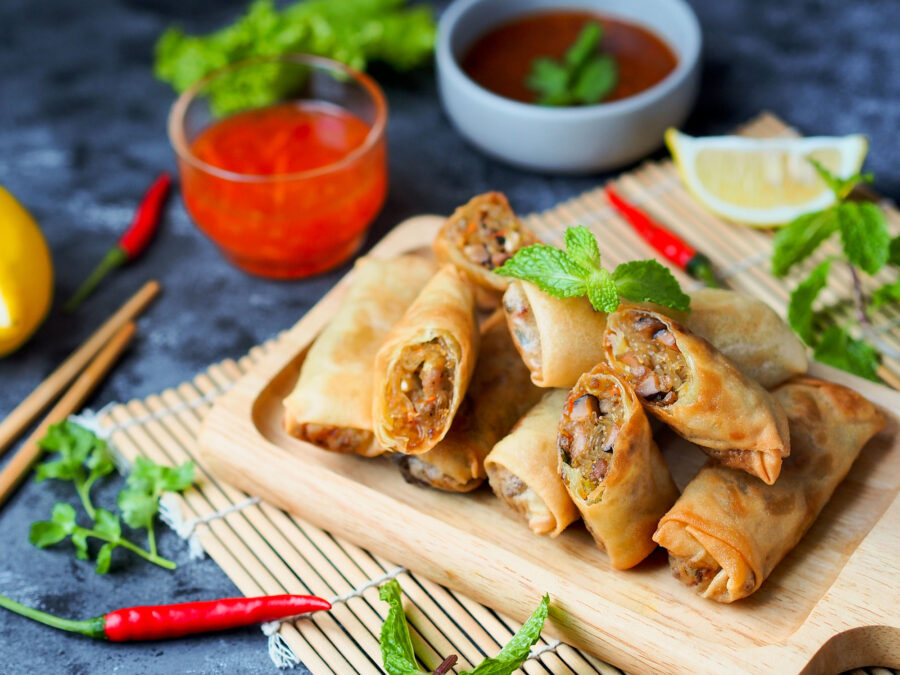 Spring rolls filled with vegetables serve with sweet and sour dipping sauce.