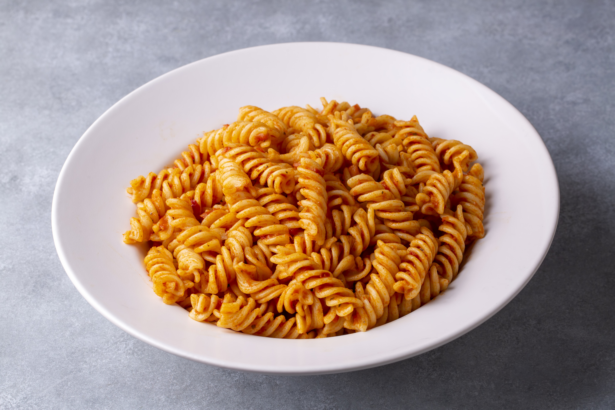 Fusilli pasta, spiral or spirali pasta with tomato sauce - Italian food style