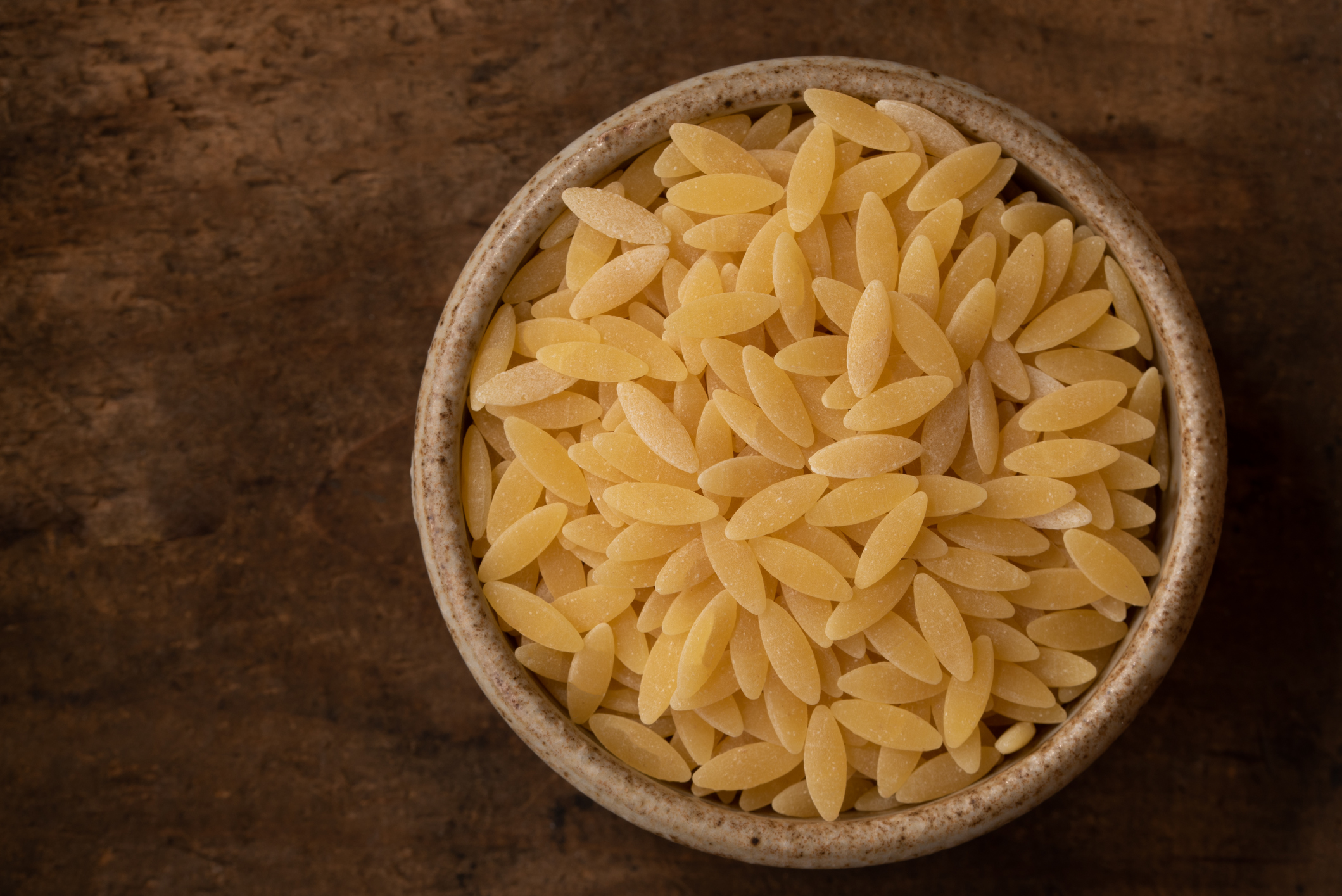 Uncooked Orzo Pasta in a Bowl