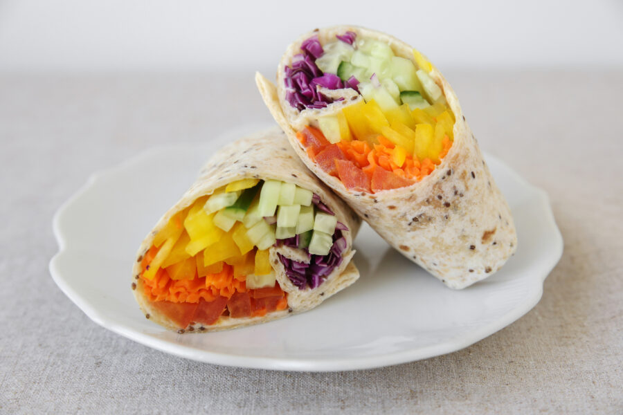 Rainbow salad tortilla wraps, soft selective focus