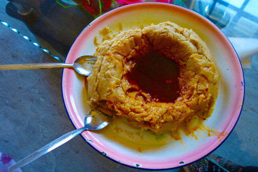 Genfo - a thick porridge eaten for brekfast in Ethiopia. It's made with barley, wheat and corn flour.