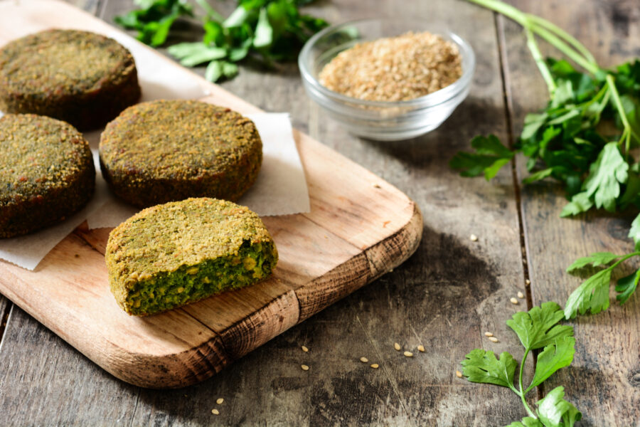 Grilled veggie hamburger on wooden table