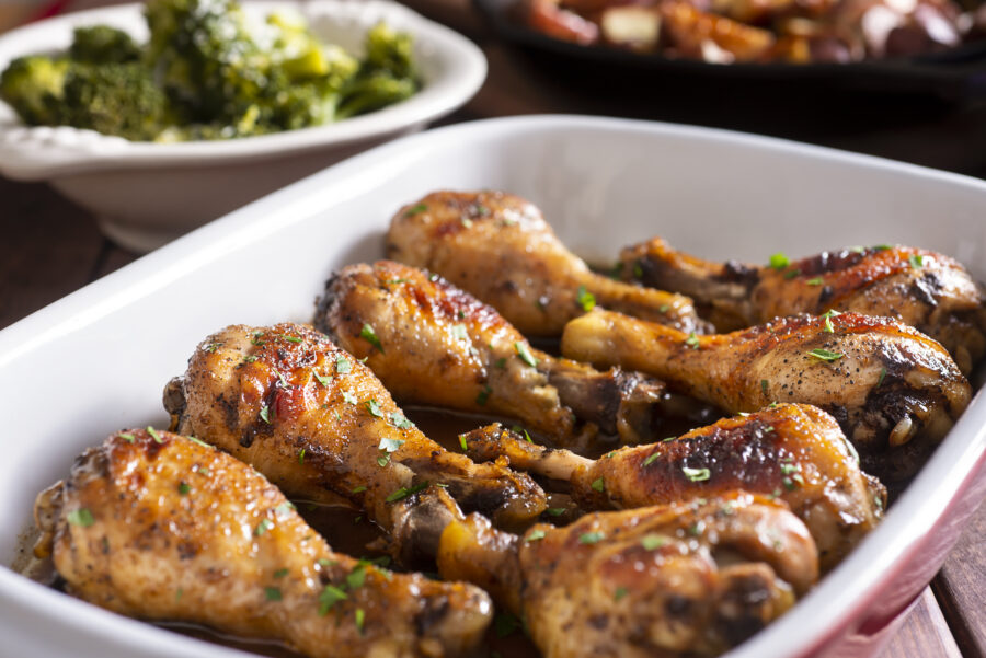 Marinated Chicken Legs in a Baking Dish with Steamed Broccoli and Roasted Potatoes