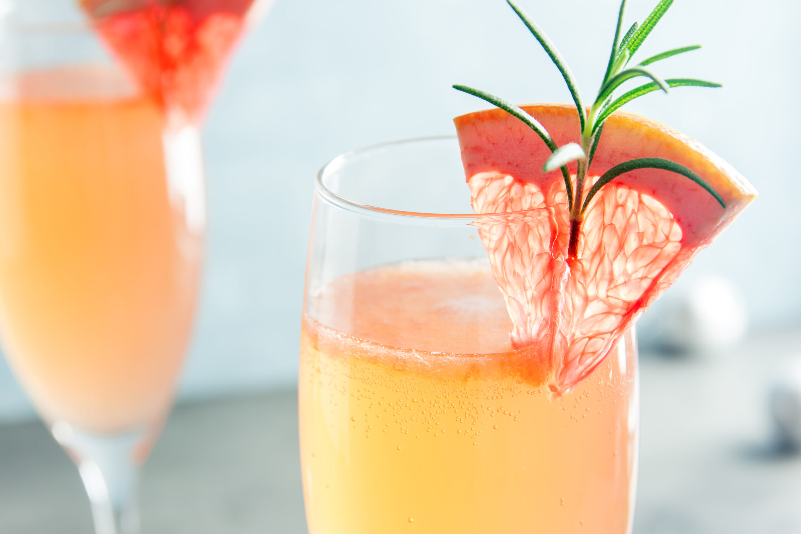 Mimosa festive drink  - Champagne cocktail Mimosa with Grapefruit and Rosemary for Christmas party, copy space