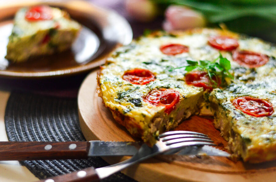 Pizza omelette with tomatoes and greens