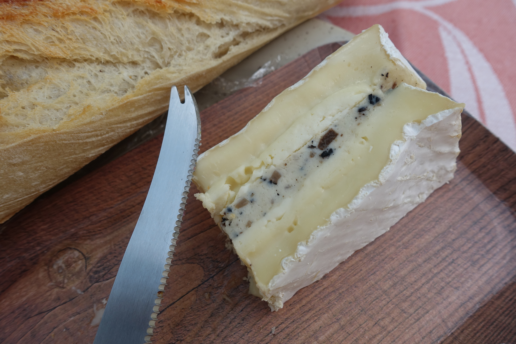 Brie Cheese with black truffle and French baguette  French gastronomy