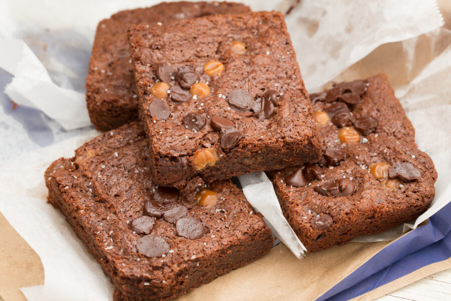 A high angle close up shot of some salted caramel brownies.