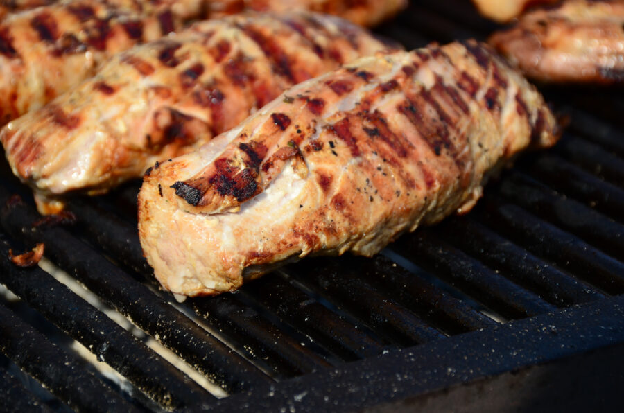 Barbecue chicken breast on a grill