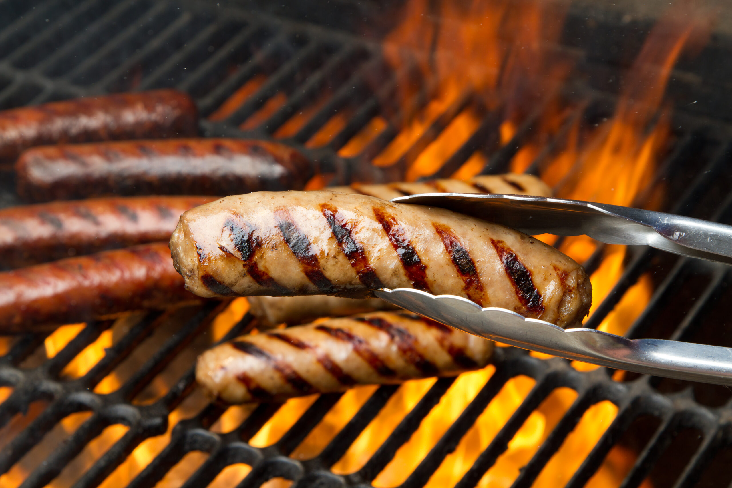 Bratwurst on a flaming grill