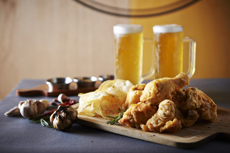 Fried chicken, potato chips and beer