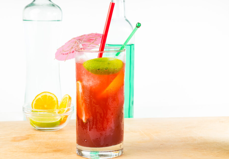 Ginger Ale  mixed with Tequila and Creme de Cassis in highball glass to create "El Diablo" cocktail, condensation on glass. Horizontal with copy space.