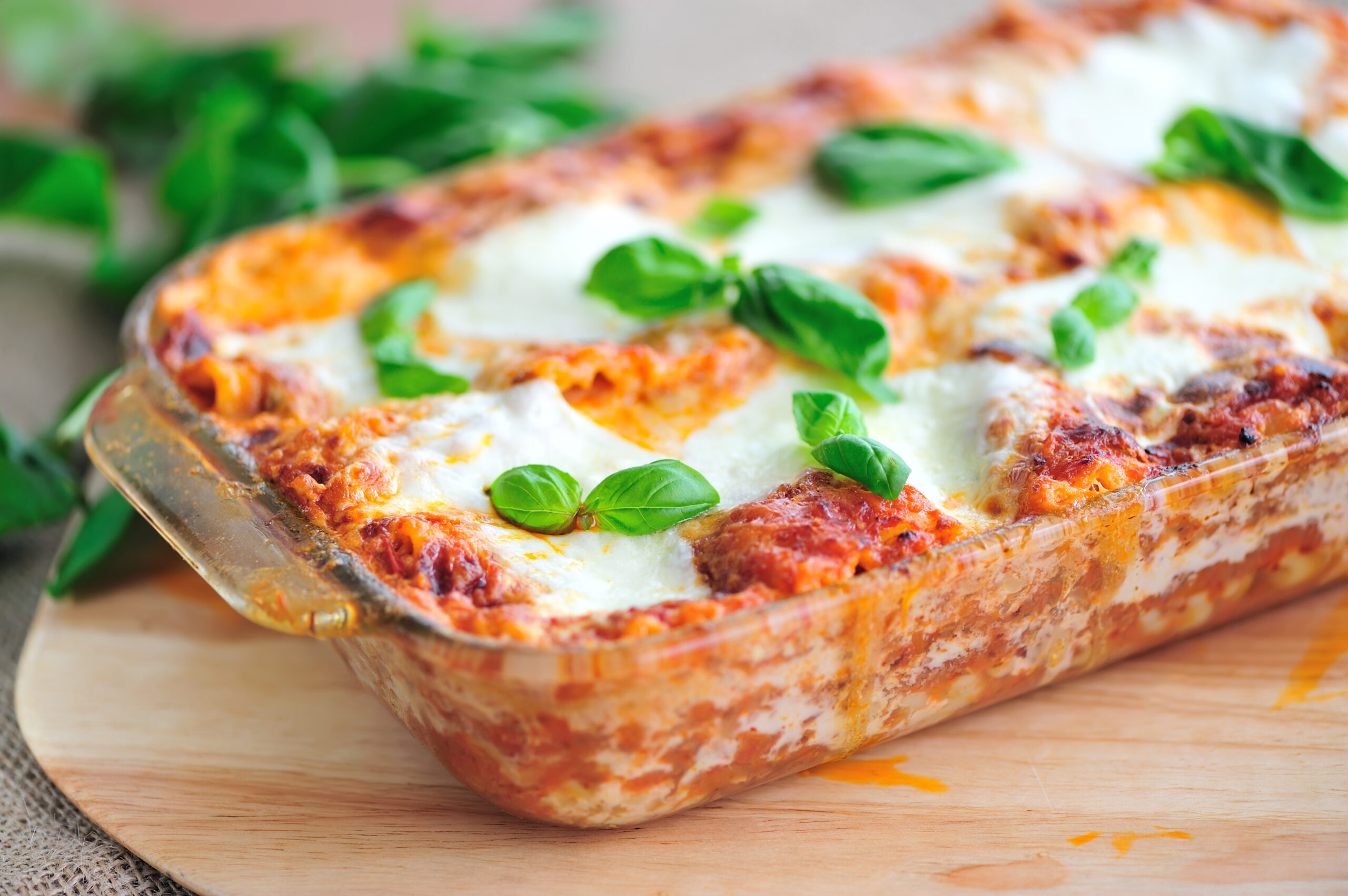 Freshly Baked lasagna Garnished with Basil Leaves