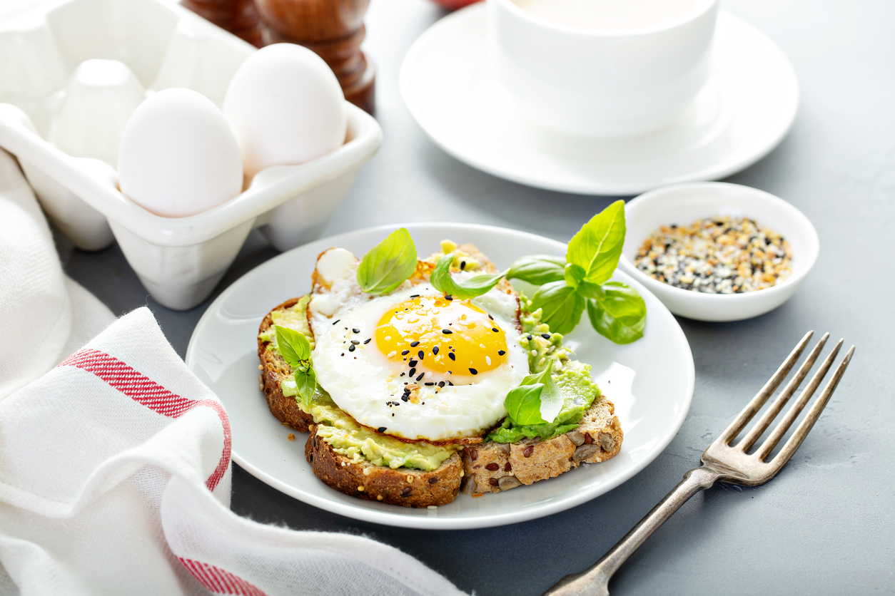 Avocado toast with fried sunny side up egg