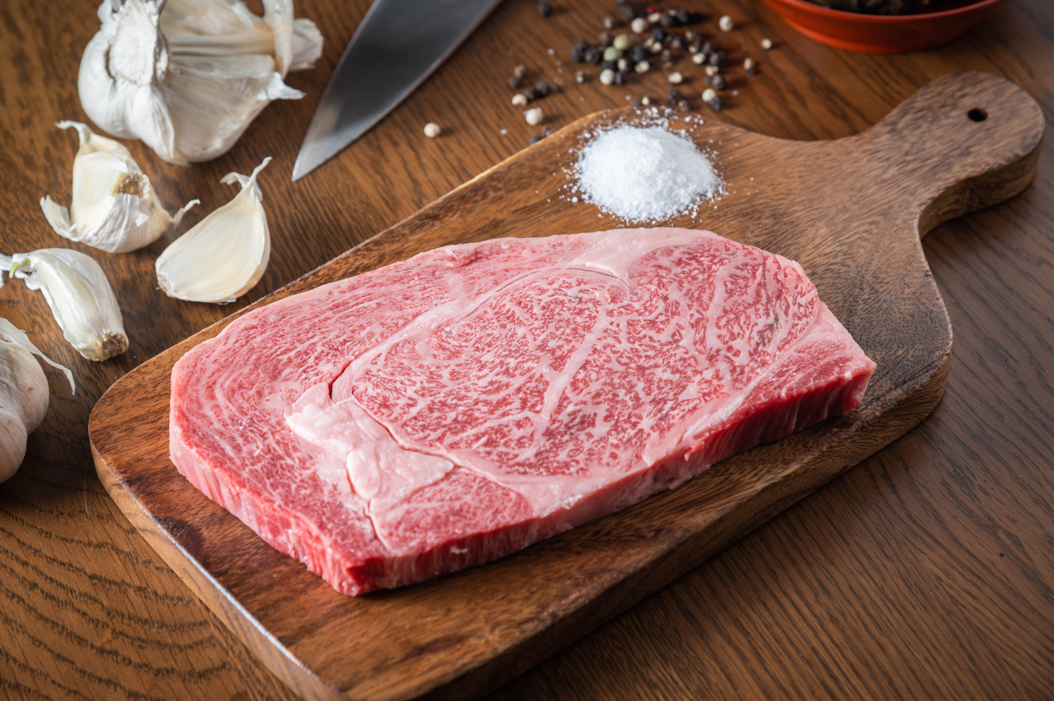 japanese wagyu ribeye beef on wooden cutting board