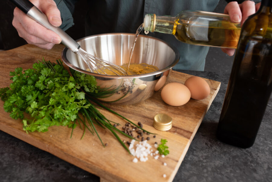 Hands prepare fresh ingredients for a tasty side dish. Close up.