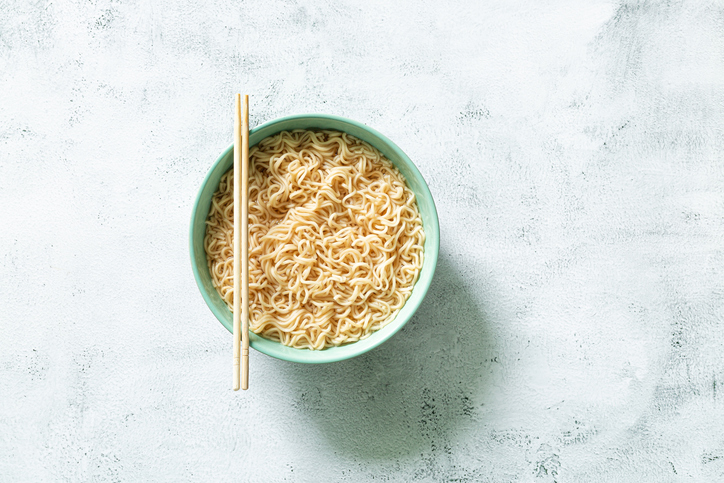 Instant noodles, Concept of tasty eating with bowl of noodles on gray background