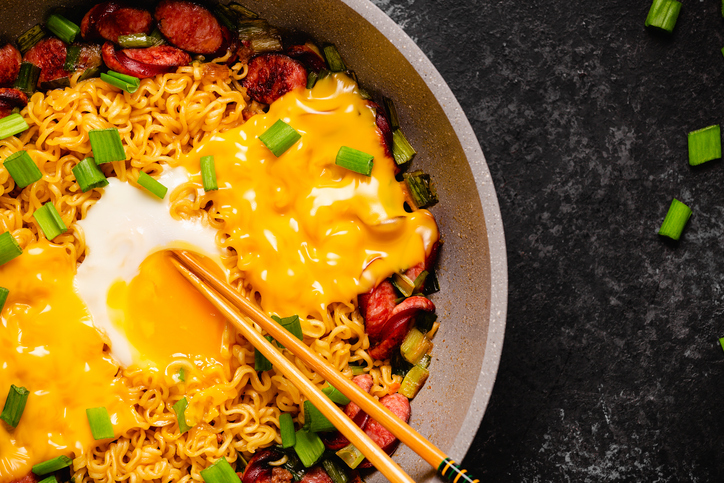 Korean style instant noodle, Shin Ramyeon with sausages, cheese, egg and green onions