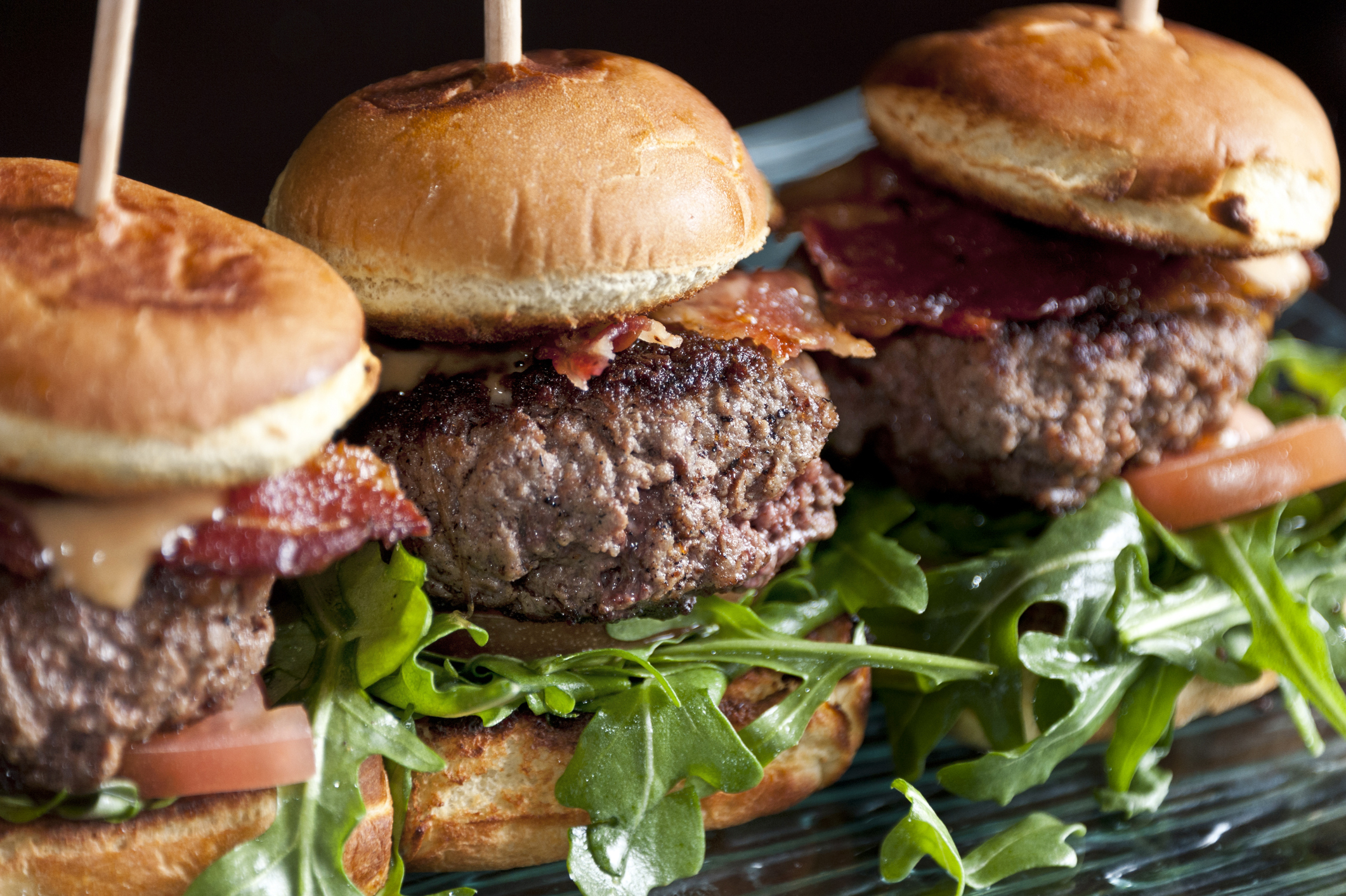 Mini kobe beef burgers on black background