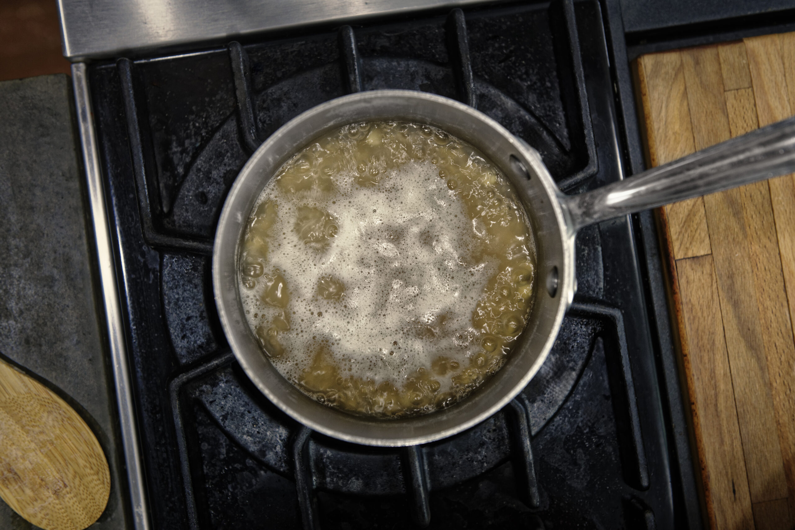 An overhead view of a pot of steaming soup