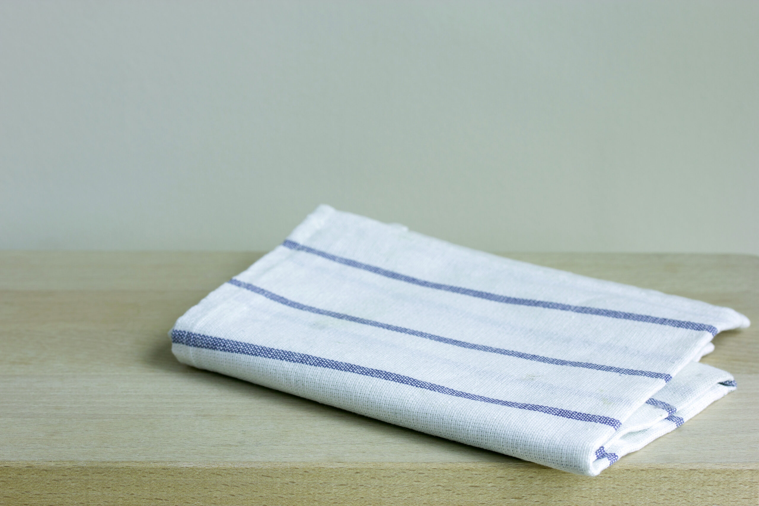 folded cotton napkin on wooden table