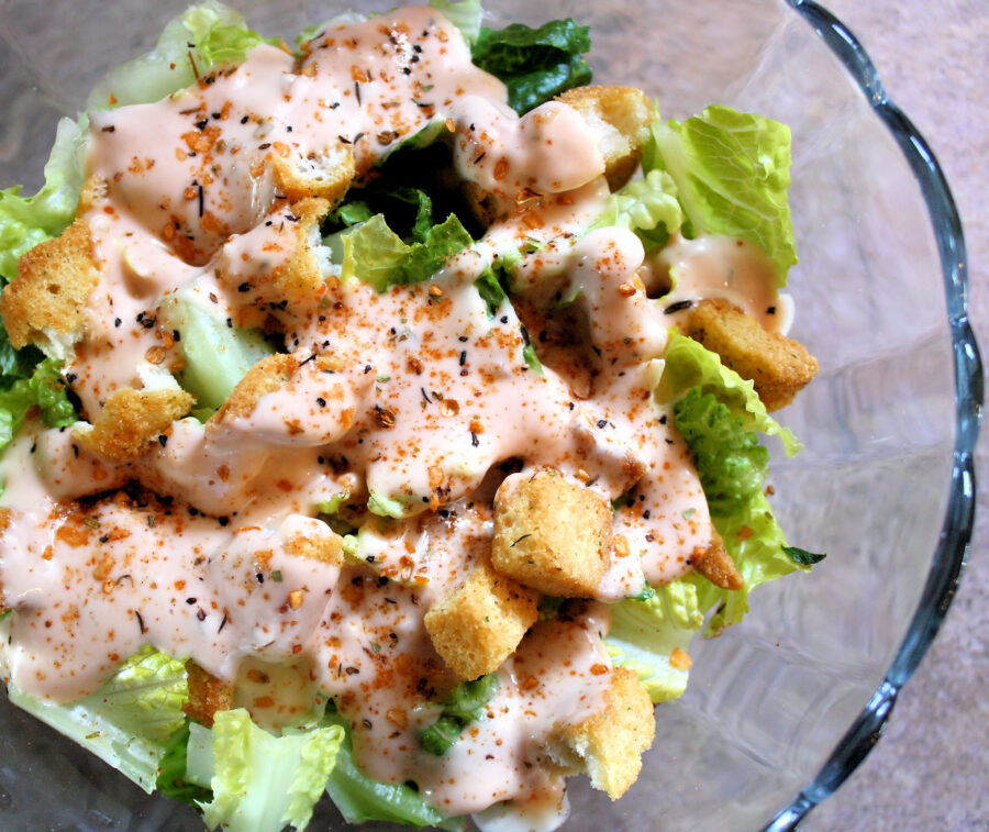 Fresh garden salad with creamy dressing, croutons and seasonings