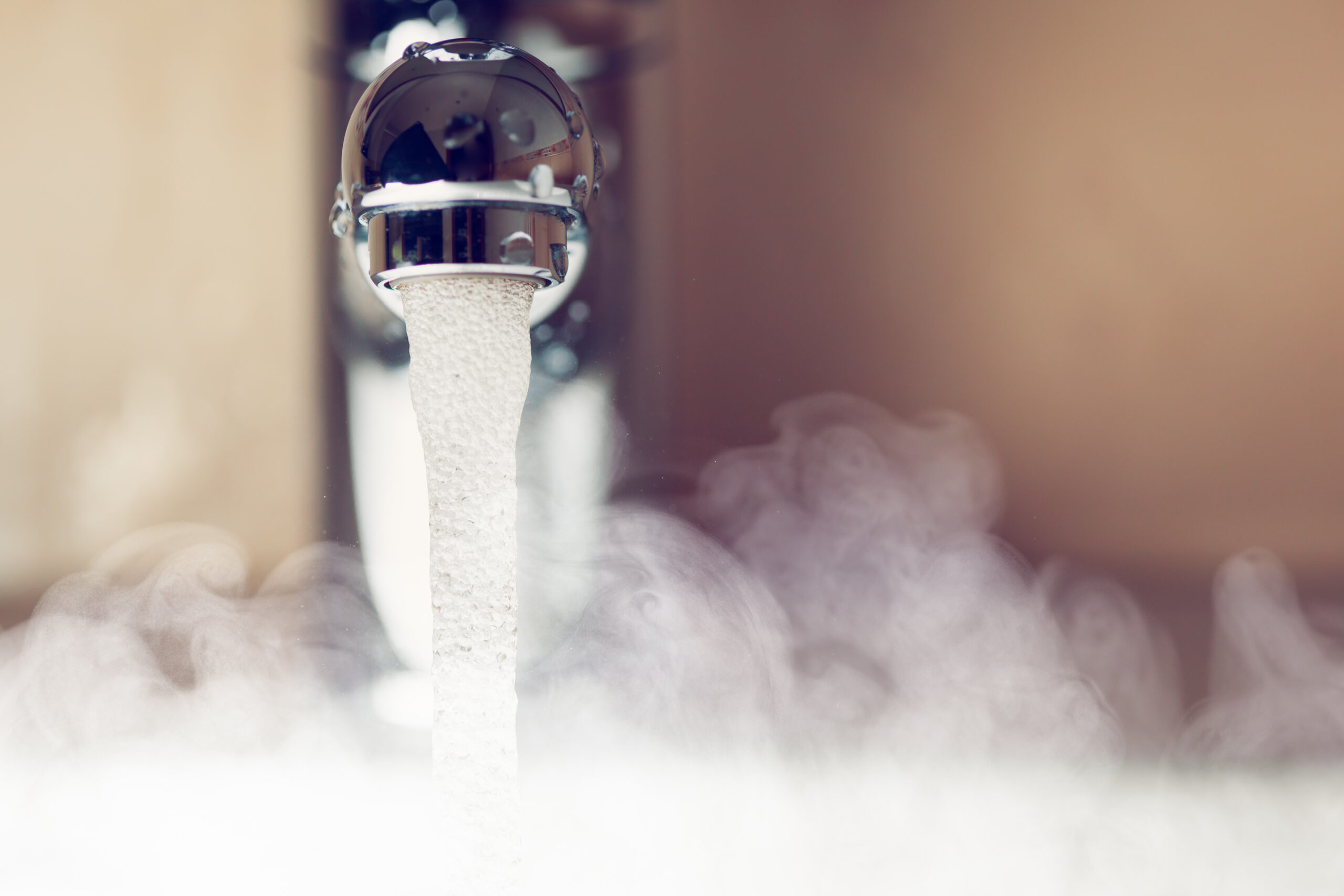 water tap with hot water steam, closeup view