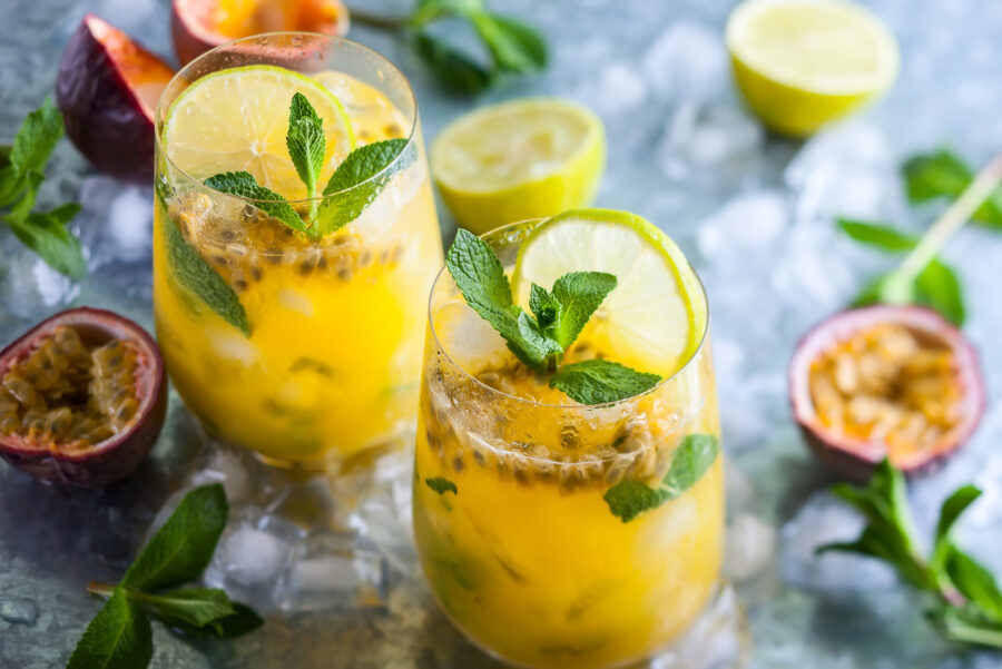 Passion fruit lemonade garnished with lime and mint