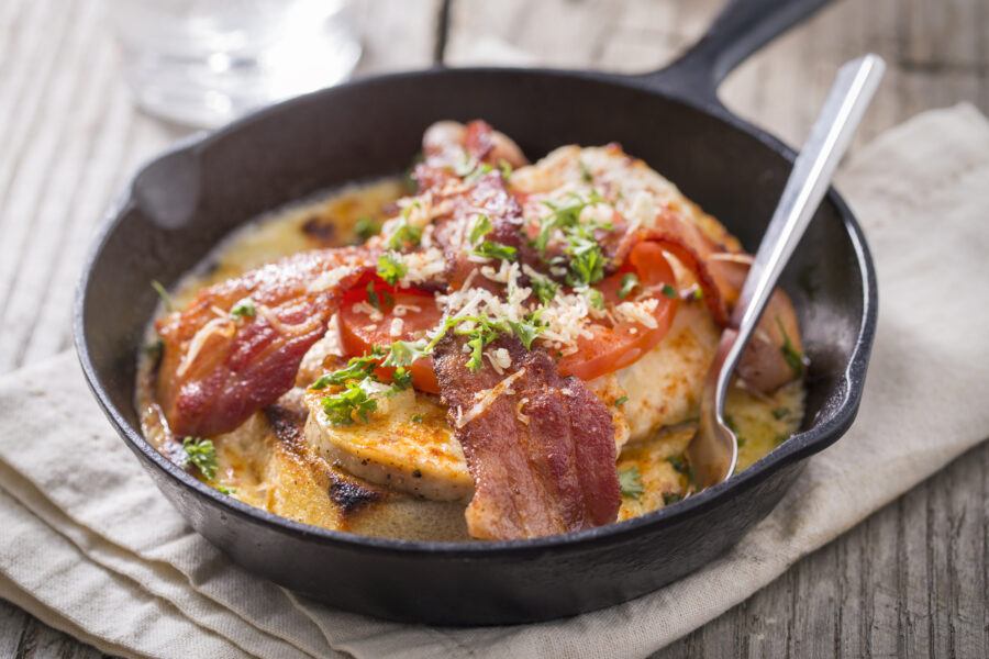 Kentucky hot brown open face sandwich made of Texas toast, turkey, and bacon. 