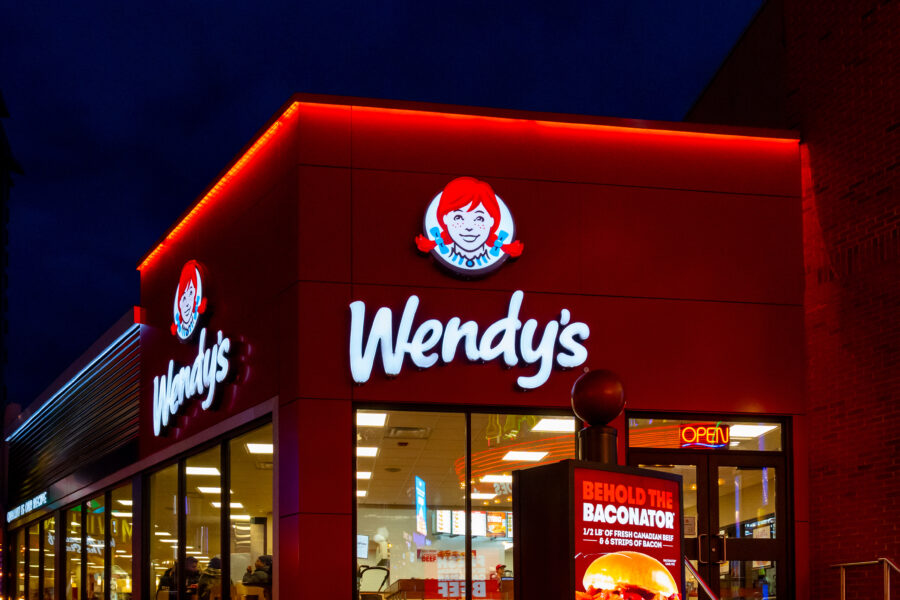 People in the  Wendy's restaurant at dusk in Niagara Falls, Ontario, Canada, on December 8, 2023. Wendy's is an American international fast food restaurant chain.