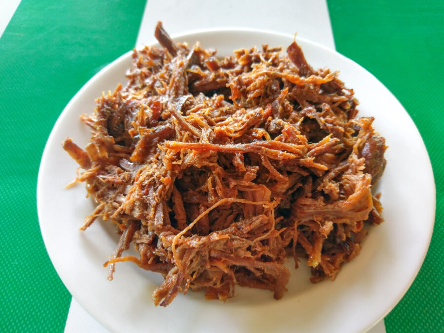 Ropa Vieja is a classic Cuban stew of shredded beef (carne mechada)