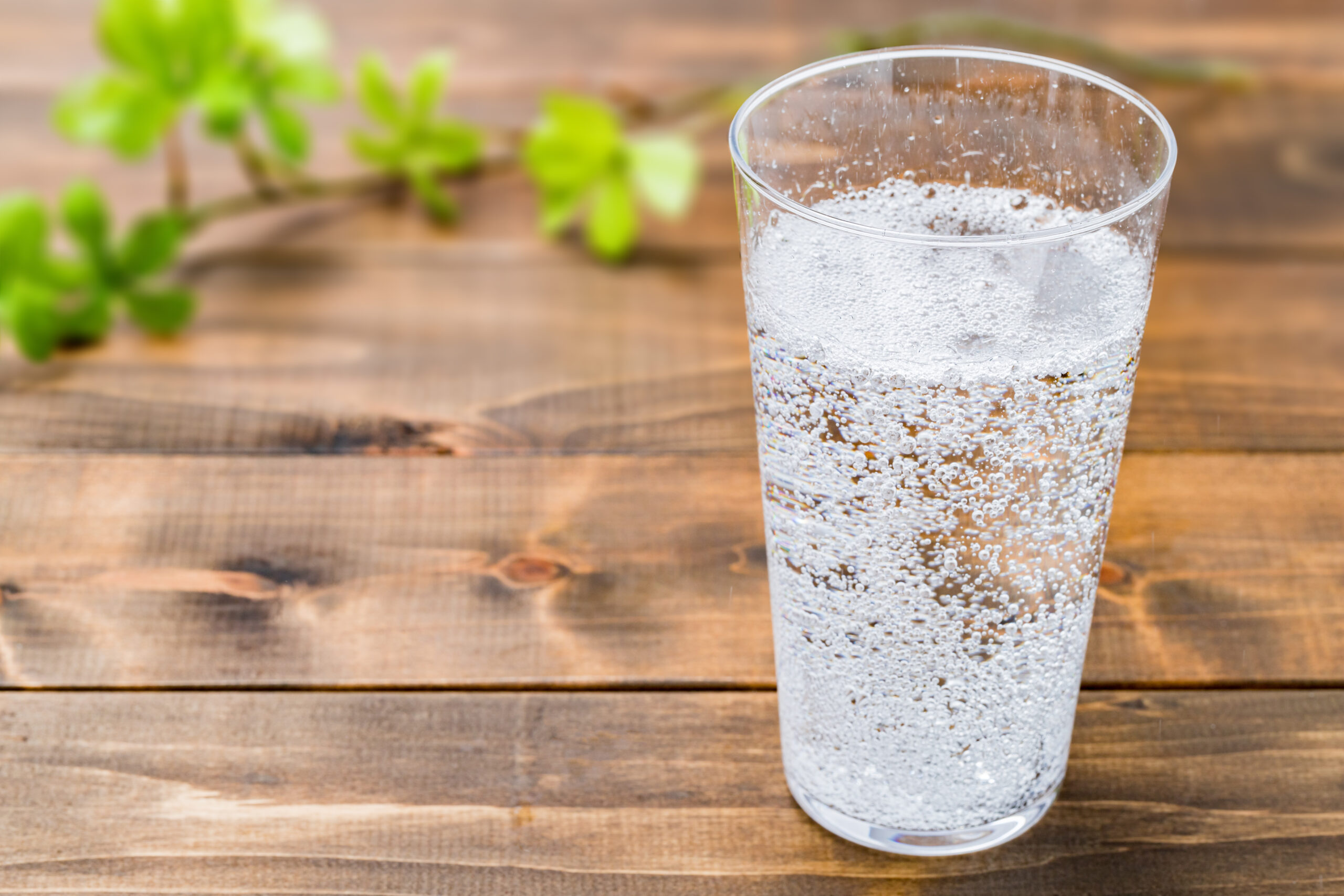 Carbonated water on wood grain background