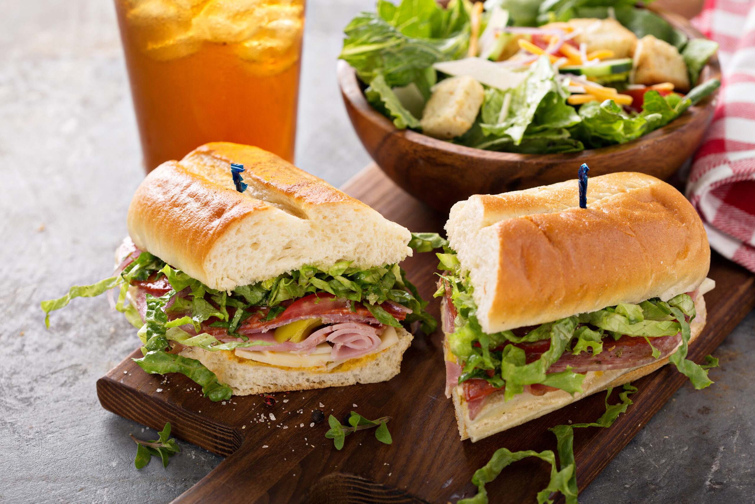 Italian meat sandwich with salad and chips for lunch