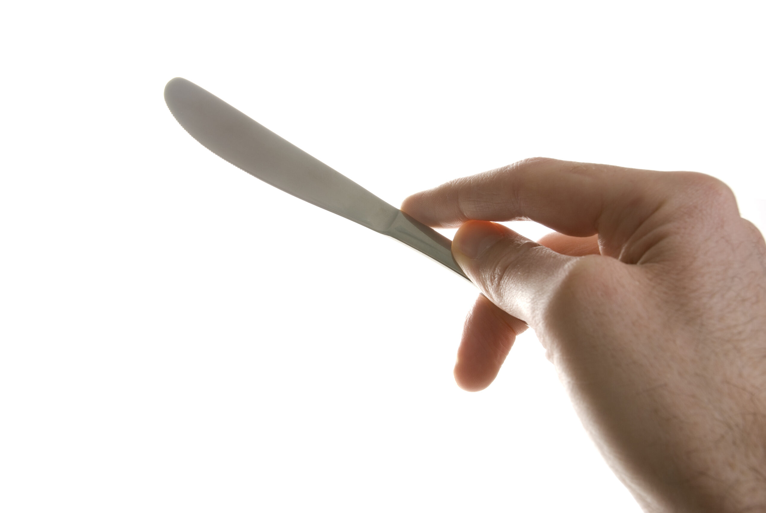 Man's hand holding a knife. Isolated on white.