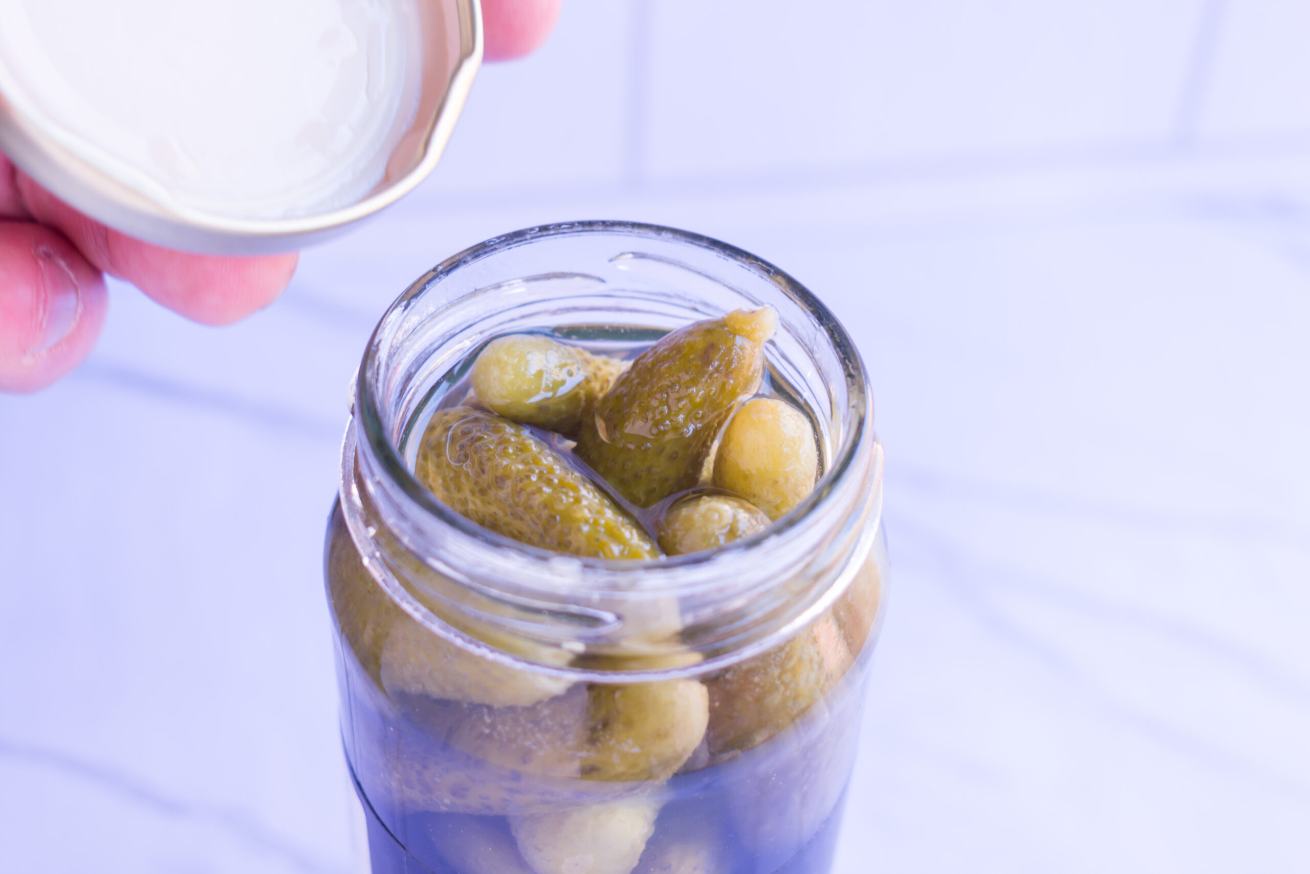 Mature man uncovers jar of homemade pickled cucumbers