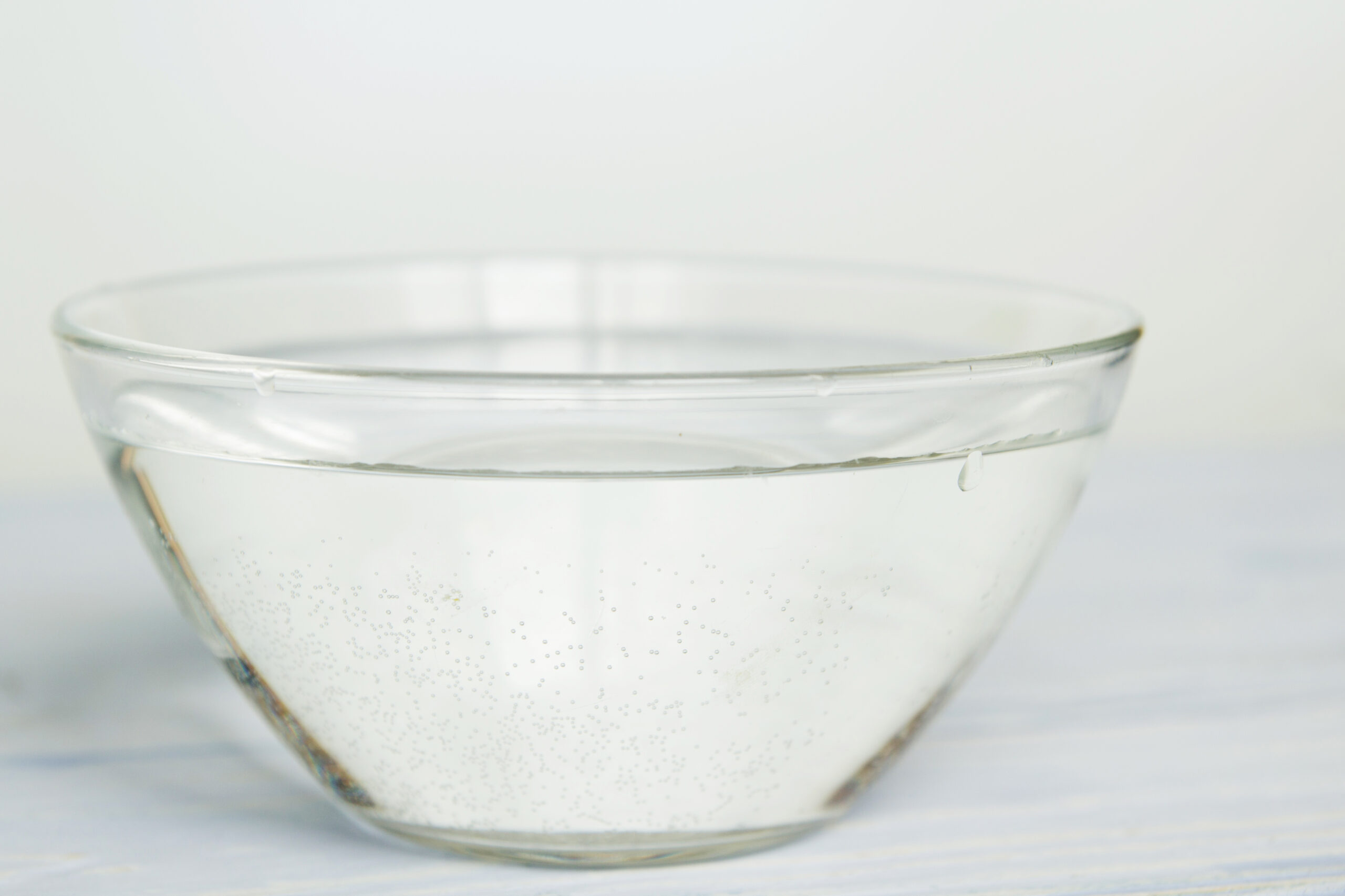 water in a bowl on a white background